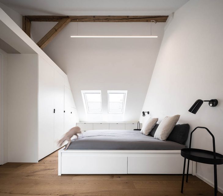 Attic Apartment with a Black Box by Komon architekti