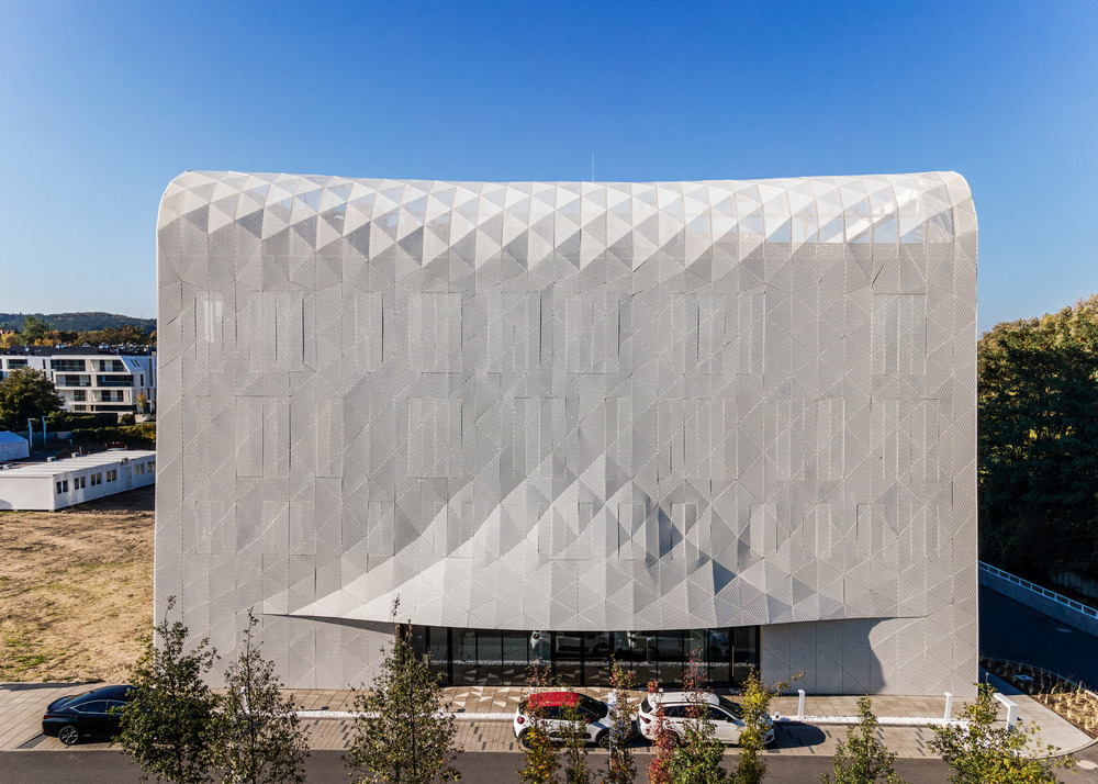 Louis Vuitton store Tokyo designed with perforated monogrammed facade