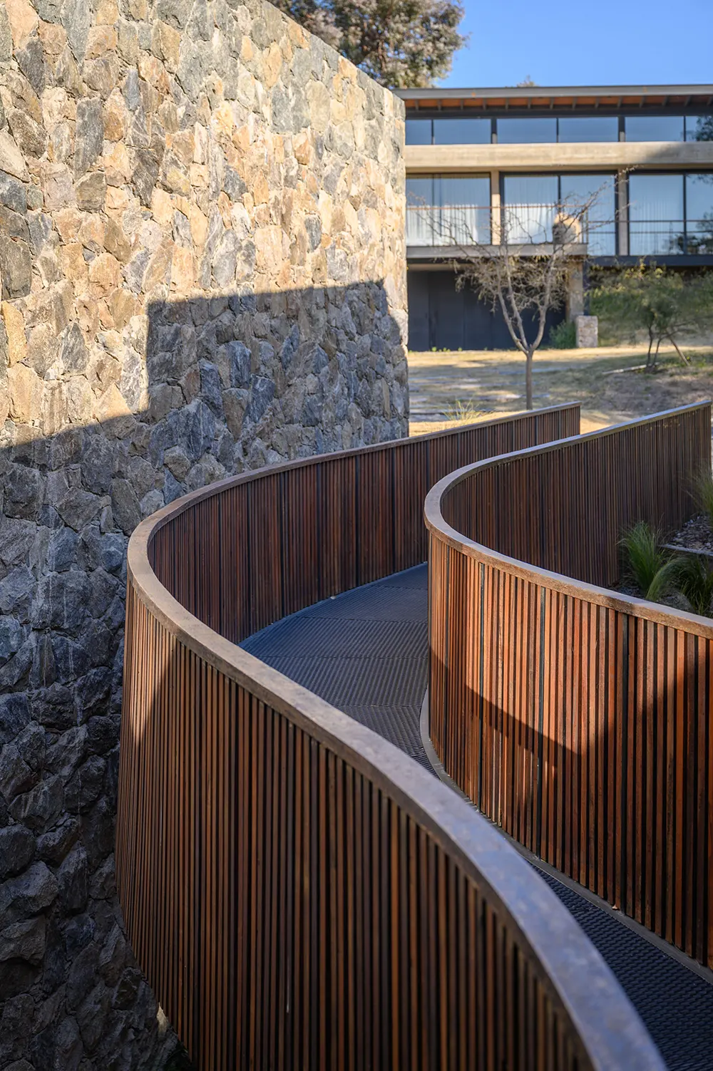 A Bridge House by Paolini Architects